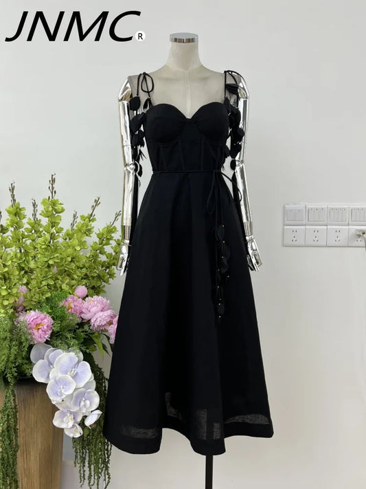 JNMC Black Floral Lace Vacation Dress – Beach-Ready Elegance for WomenJNMC Black Temperament Design Sense Spring And Summer New Flower Lace Shoulder Strap Vacation Beach Style Dress For Women 2024